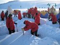 Quarrying snow blocks to build shelters