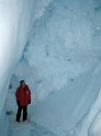 Jim in the depths of an ice cave in a glacier floating on the frozen ocean.