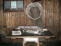 Scott Hut - a work table with a dried penguin and a plankton net